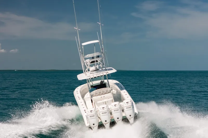 Slide: The Image of 2006 Venture 39 Open boat speeding on ocean with four powerful engines. - 9
