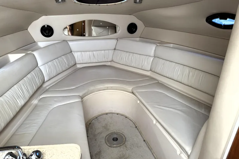 Slide: The Image of Interior of 2005 Regal Commodore 2665 boat with white leather seating. - 12