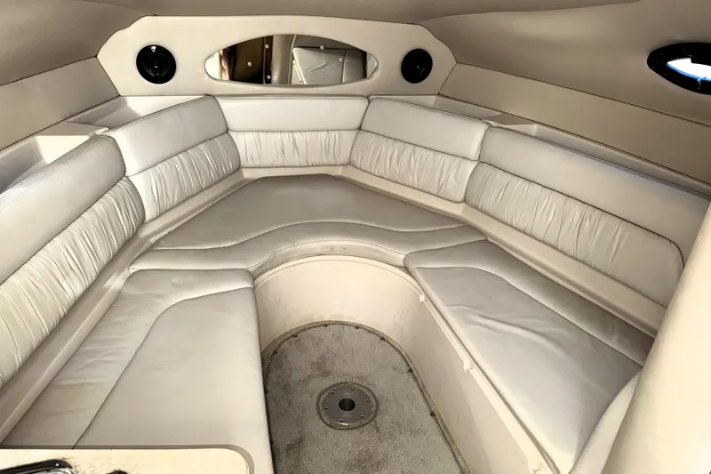 Slide: The Image of Interior of 2005 Regal Commodore 2665 boat with white leather seating. - 14