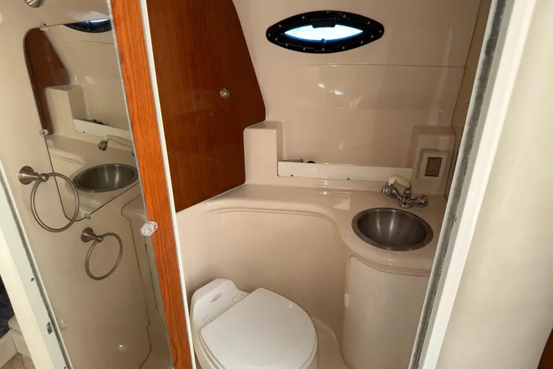 Slide: The Image of Bathroom interior of 2005 Regal Commodore 2665 boat with sink and toilet. - 18