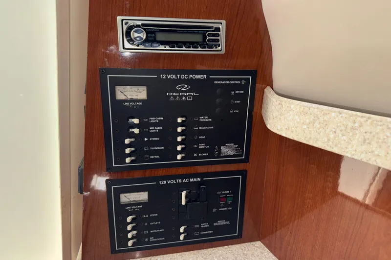Slide: The Image of Control panel of a 2005 Regal Commodore 2665 boat with Kenwood stereo system. - 22