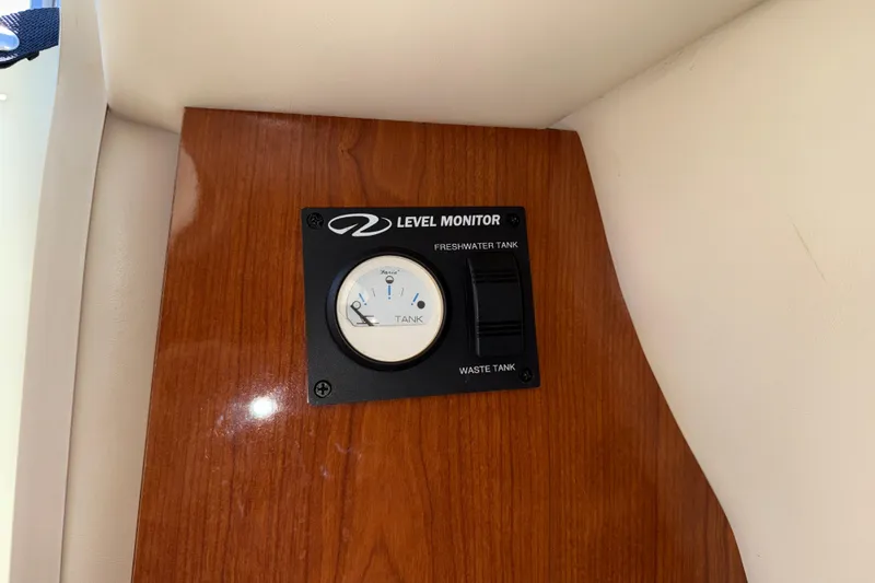 Slide: The Image of Level monitor panel on 2005 Regal Commodore 2665 boat, showing tank gauges. - 23