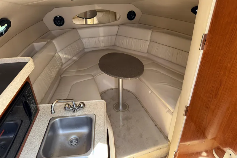Slide: The Image of Interior of 2005 Regal Commodore 2665 boat with kitchenette and seating area. - 30