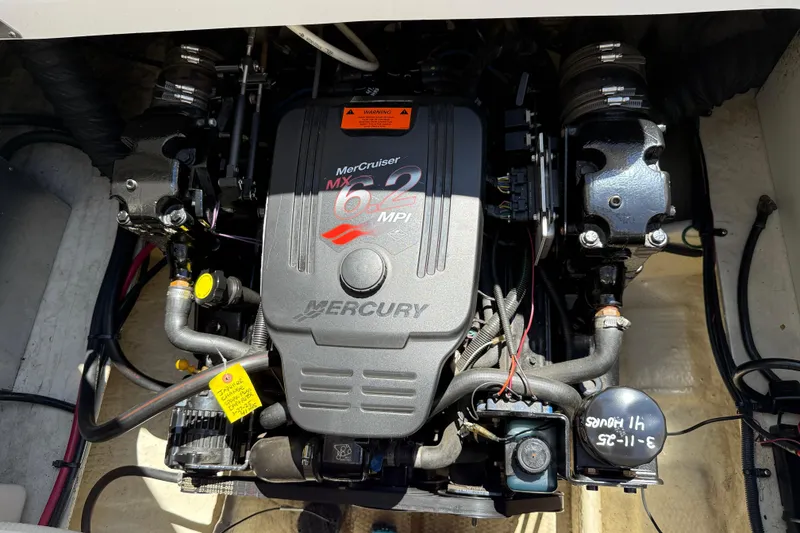 Slide: The Image of Engine of a 2005 Regal Commodore 2665 boat, featuring a MerCruiser 6.2 MPI. - 31