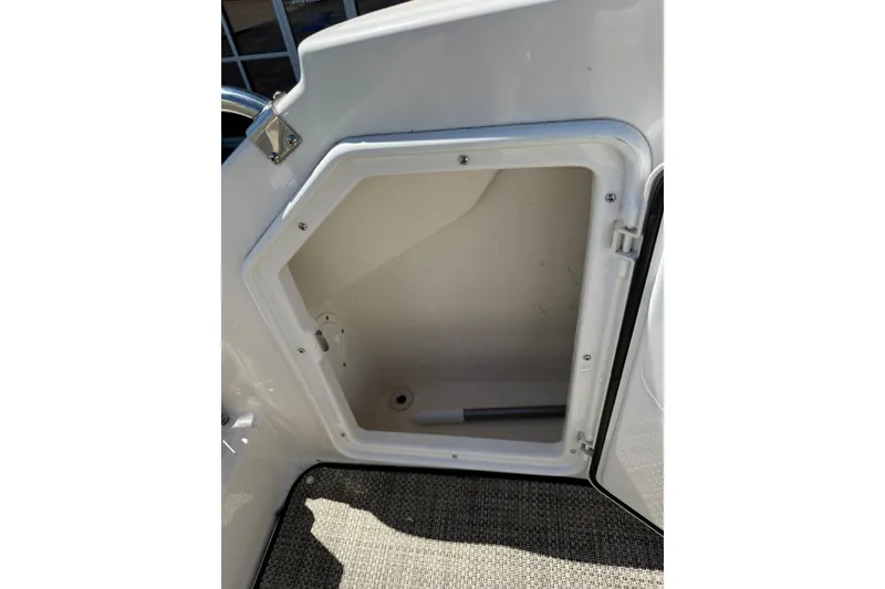 Slide: The Image of Open storage compartment on a 2005 Regal Commodore 2665 boat. - 38