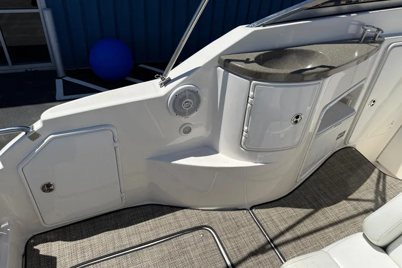 Slide: The Image of Interior view of a 2005 Regal Commodore 2665 boat, featuring a sink and storage compartments. - 39