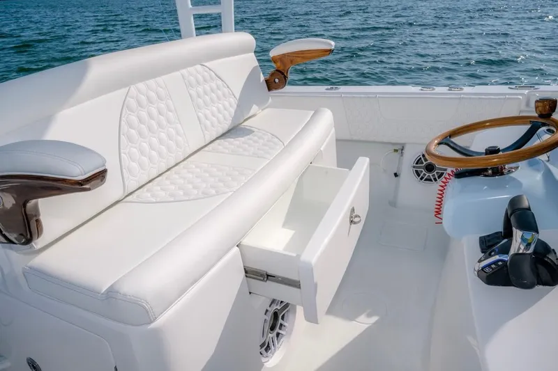 Slide: The Image of Luxurious interior of 2026 Contender 39 ST boat with white seating and wooden accents. - 12
