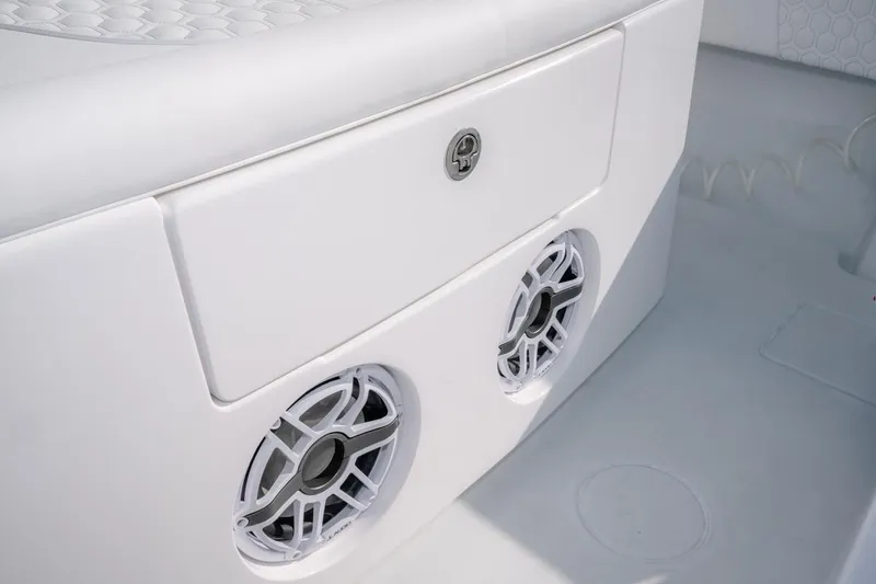 Slide: The Image of 2026 Contender 39 ST boat interior with speakers and storage compartment. - 13