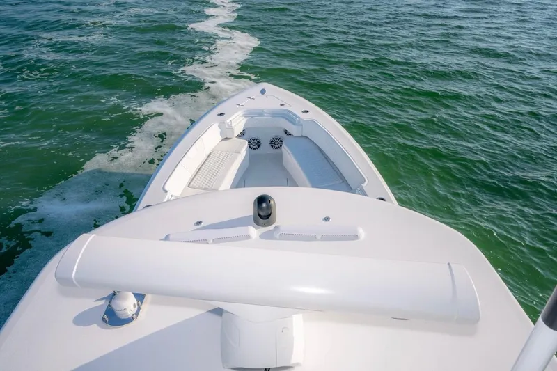 Slide: The Image of 2026 Contender 39 ST boat cruising on open water, showcasing sleek design and spacious deck. - 19