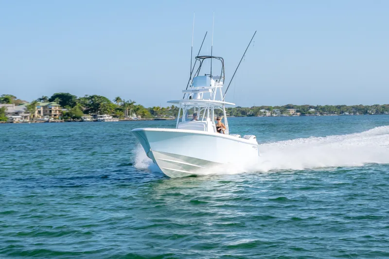 Slide: The Image of 2026 Contender 39 ST boat cruising on a sunny day in coastal waters. - 22
