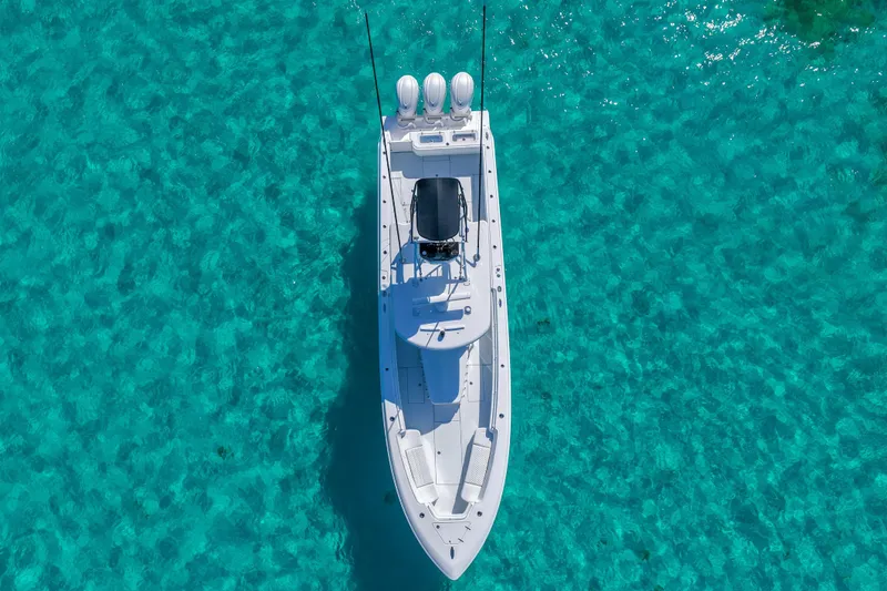 Slide: The Image of Aerial view of 2026 Contender 39 ST boat in clear blue water. - 5