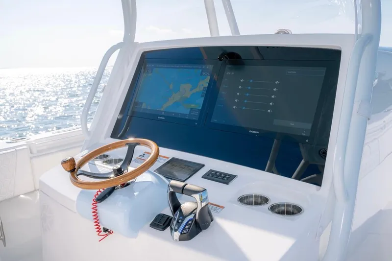 Slide: The Image of Helm of 2026 Contender 39 ST boat with advanced navigation displays. - 8