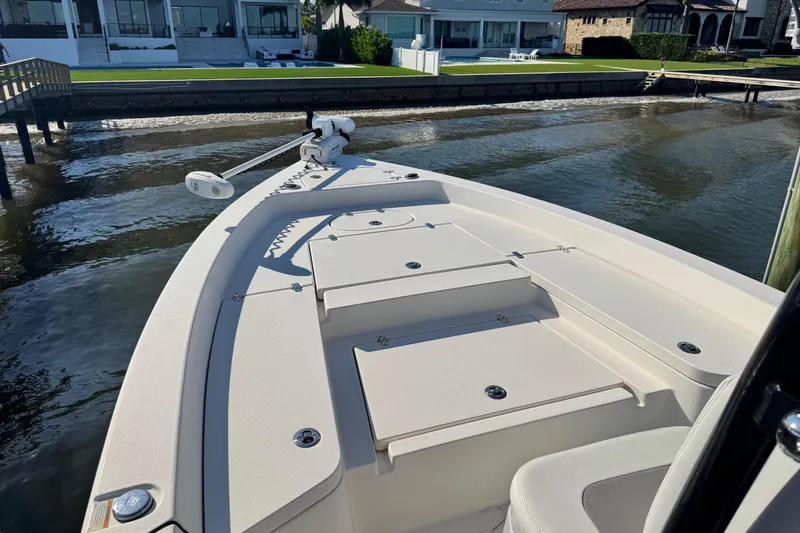 Slide: The Image of 2022 Pathfinder 2400 TRS boat docked by waterfront homes. - 11