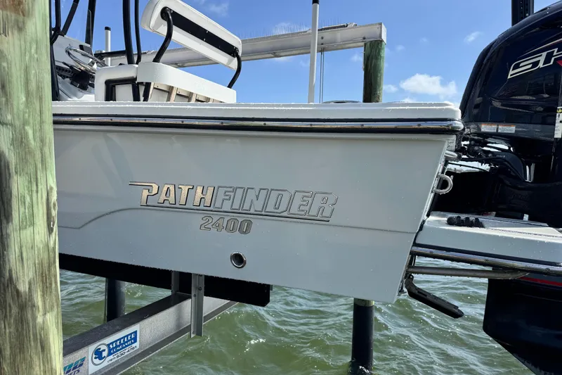 Slide: The Image of 2022 Pathfinder 2400 TRS boat on a boat lift. - 22