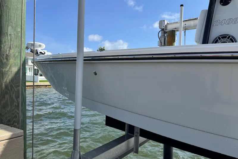 Slide: The Image of 2022 Pathfinder 2400 TRS boat docked, side view. - 24