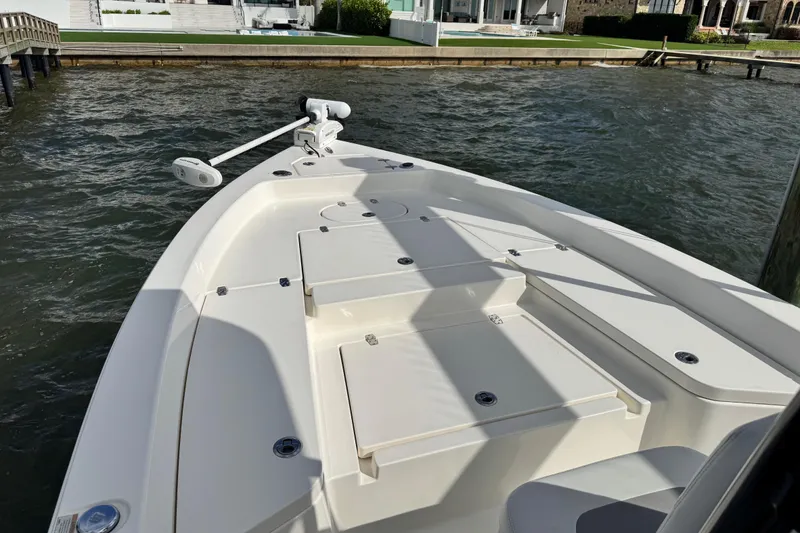 Slide: The Image of 2022 Pathfinder 2400 TRS boat docked by waterfront homes. - 25