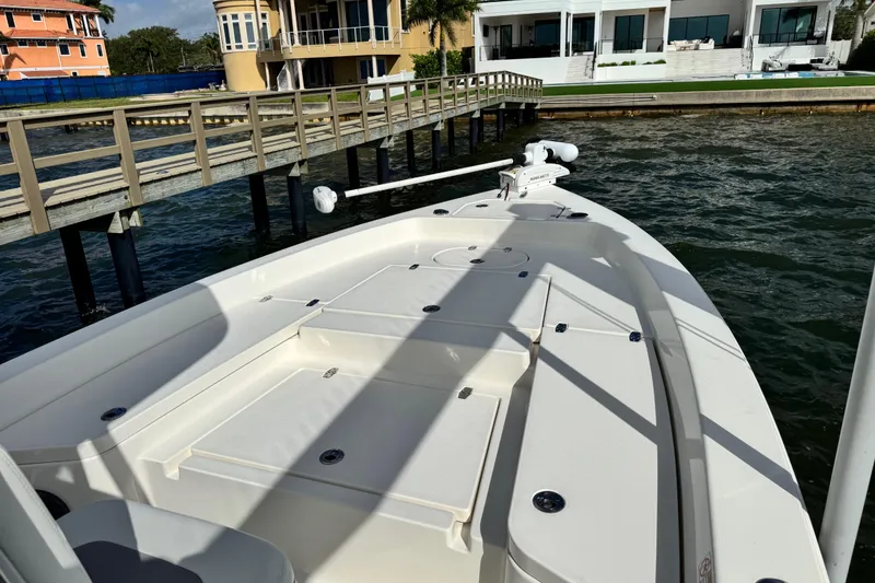 Slide: The Image of Pathfinder 2400 TRS 2022 boat docked on a sunny day. - 26