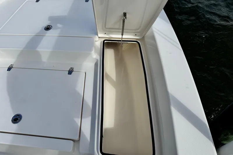 Slide: The Image of Open storage compartment on 2022 Pathfinder 2400 TRS boat, showing interior details. - 30
