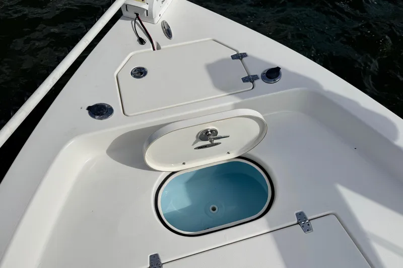 Slide: The Image of Pathfinder 2400 TRS 2022 boat with open storage compartment. - 32