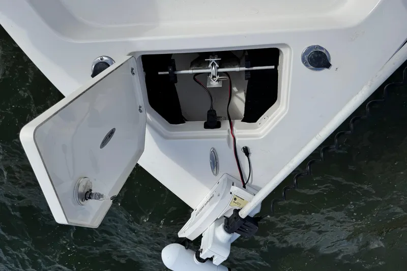 Slide: The Image of Open hatch on 2022 Pathfinder 2400 TRS boat, showing internal wiring and components. - 33