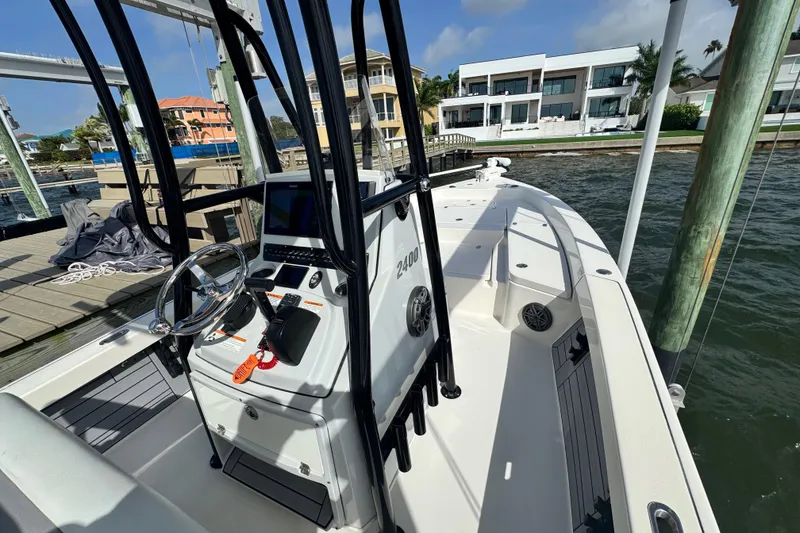 Slide: The Image of 2022 Pathfinder 2400 TRS boat docked by waterfront homes. - 39