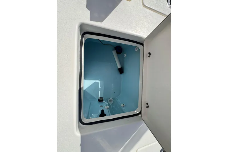 Slide: The Image of Open storage compartment in 2022 Pathfinder 2400 TRS boat. - 47