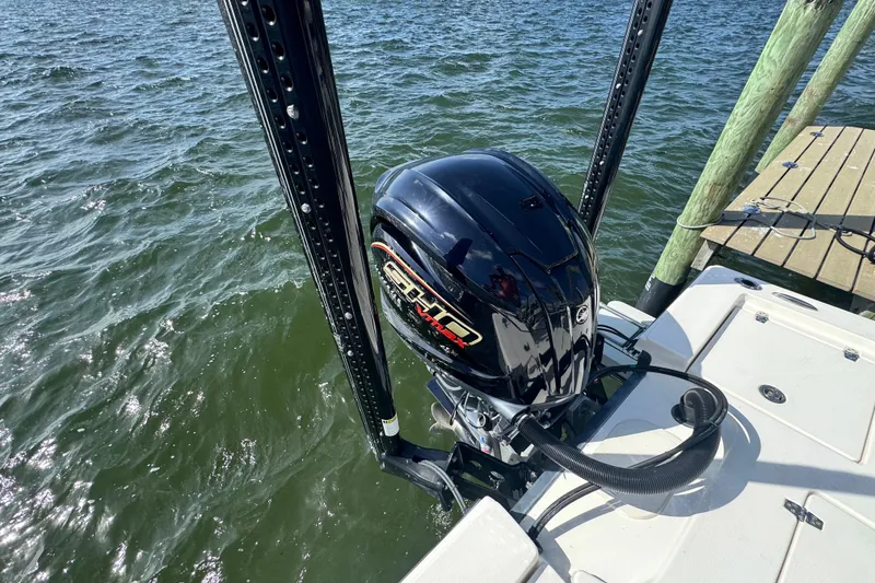 Slide: The Image of 2022 Pathfinder 2400 TRS boat engine on water near dock. - 50