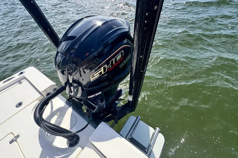Slide: The Image of 2022 Pathfinder 2400 TRS boat with Yamaha outboard motor on water. - 51