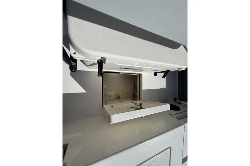 Slide: The Image of 2022 Pathfinder 2400 TRS boat storage compartment with Engel cooler. - 55