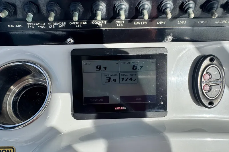 Slide: The Image of Dashboard of a 2022 Pathfinder 2400 TRS boat with Yamaha display and controls. - 56