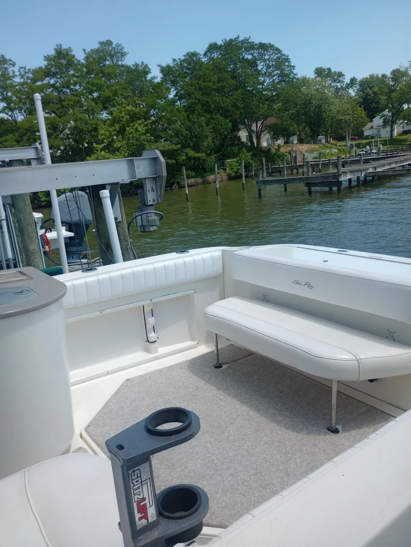 Slide: The Image of Interior of a 2005 Sea Ray 270 Amberjack with seating by the water. - 11