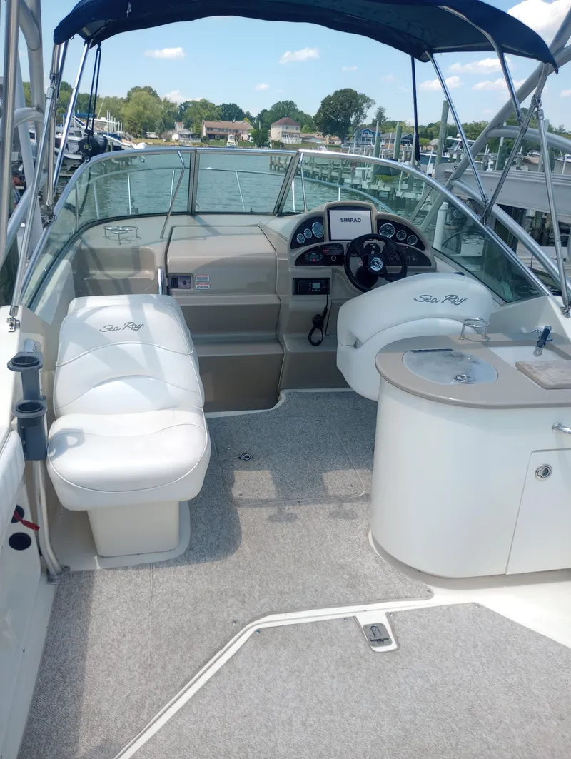 Slide: The Image of Interior of a 2005 Sea Ray 270 Amberjack with helm and seating area. - 13