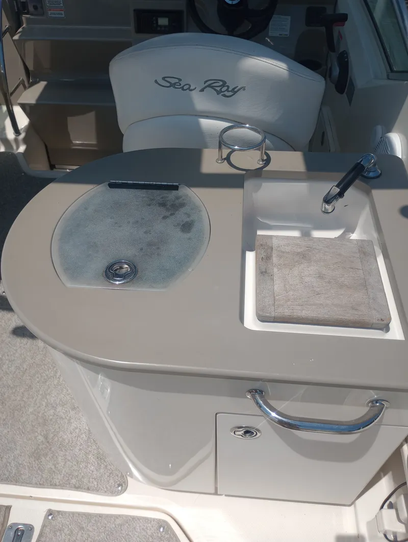 Slide: The Image of 2005 Sea Ray 270 Amberjack boat kitchenette with sink and storage. - 14