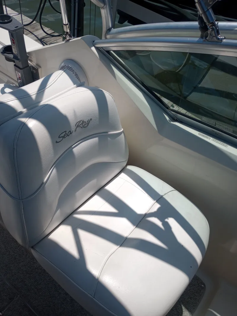 Slide: The Image of Interior of a 2005 Sea Ray 270 Amberjack boat with white seating. - 18