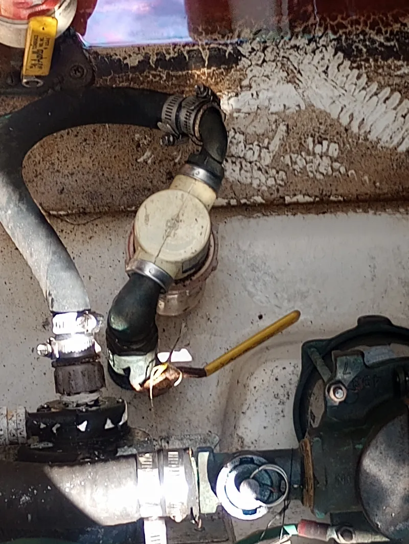 Slide: The Image of Engine compartment of 2005 Sea Ray 270 Amberjack with hoses and valves. - 35