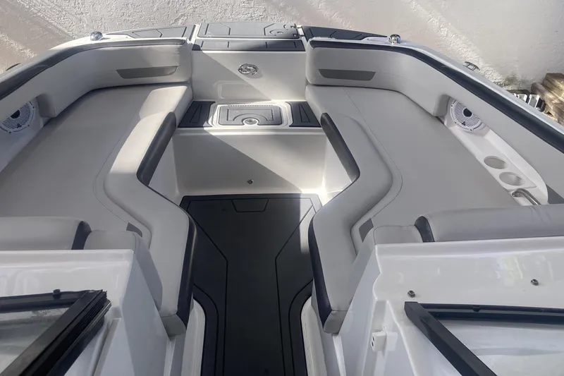Slide: The Image of 2023 Hurricane SunDeck 235 OB boat interior with sleek seating and modern design. - 10