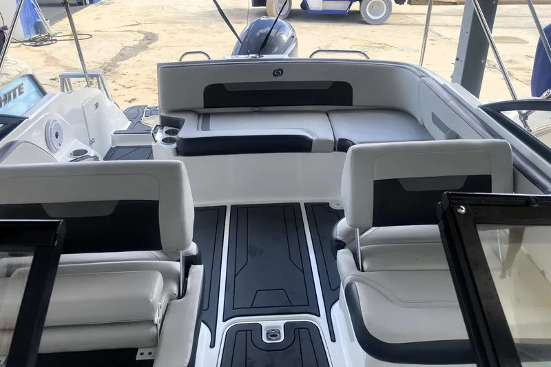 Slide: The Image of 2023 Hurricane SunDeck 235 OB interior with sleek seating and modern design. - 28