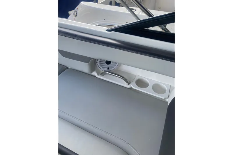 Slide: The Image of Interior of 2023 Hurricane SunDeck 235 OB boat with seating and cup holders. - 34