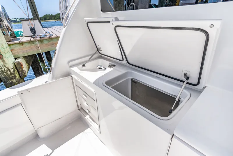 Slide: The Image of The image shows open storage compartments and drawers on a boat. - 24