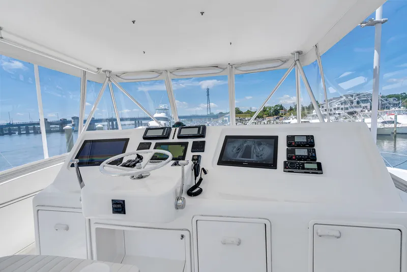 Slide: The Image of Interior view of a 2004 Ocean Yachts 50 Convertible helm with modern electronics. - 28