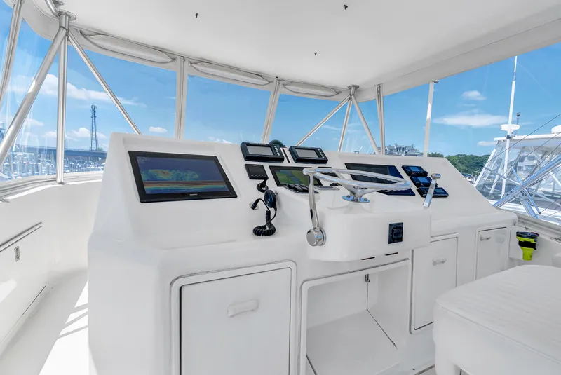 Slide: The Image of The cockpit of a 2004 Ocean Yachts 50 Convertible with modern navigation equipment. - 29