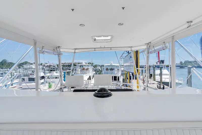 Slide: The Image of View from a yacht's flybridge overlooking a busy marina with several boats. - 33
