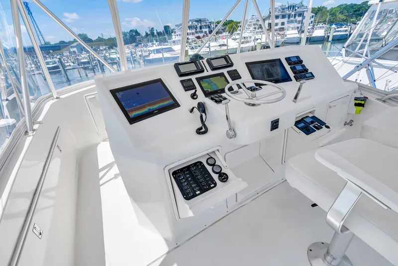 Slide: The Image of The cockpit of a 2004 Ocean Yachts 50 Convertible with modern navigation equipment and controls. - 35