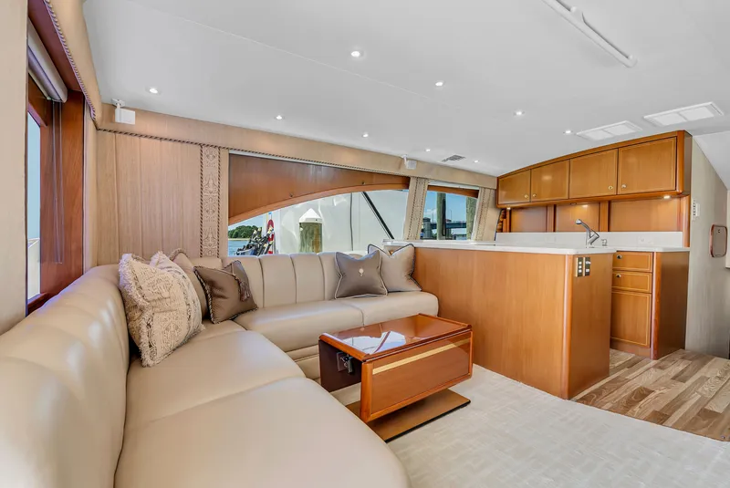 Slide: The Image of Interior of a yacht with beige sofa and wooden furniture. - 51