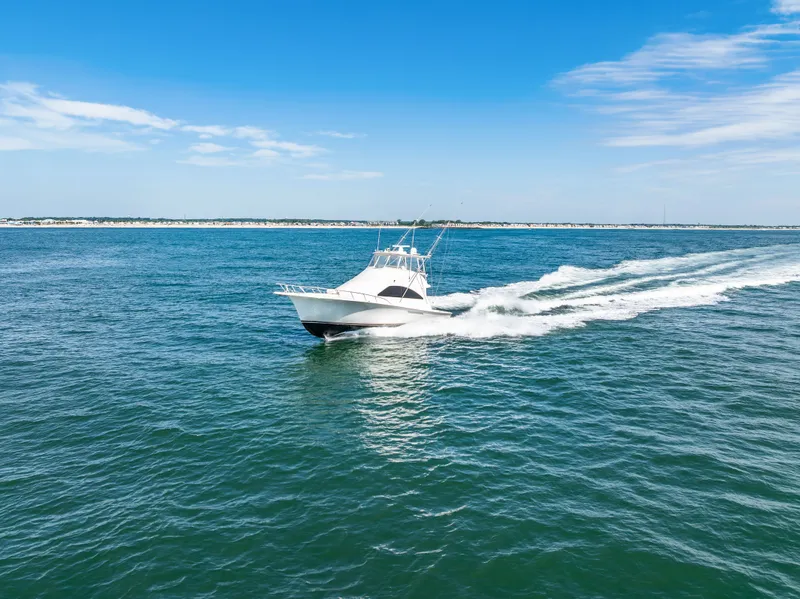 Slide: The Image of A 2004 Ocean Yachts 50 Convertible speeds across the blue sea. - 9