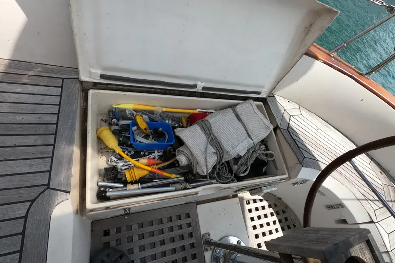 Slide: The Image of Open storage compartment on 1986 Ta Shing Baba 40 sailboat, filled with nautical gear and tools. - 10