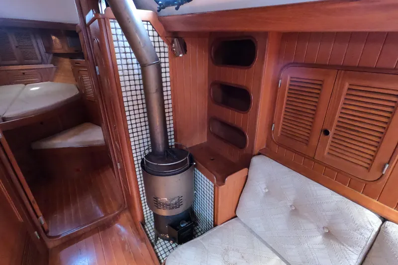 Slide: The Image of Interior of 1986 Ta Shing Baba 40 sailboat with wood paneling and stove. - 20