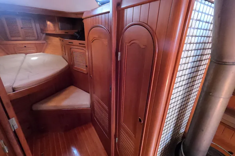 Slide: The Image of Interior of 1986 Ta Shing Baba 40 sailboat with wooden cabinetry and cozy berth. - 21