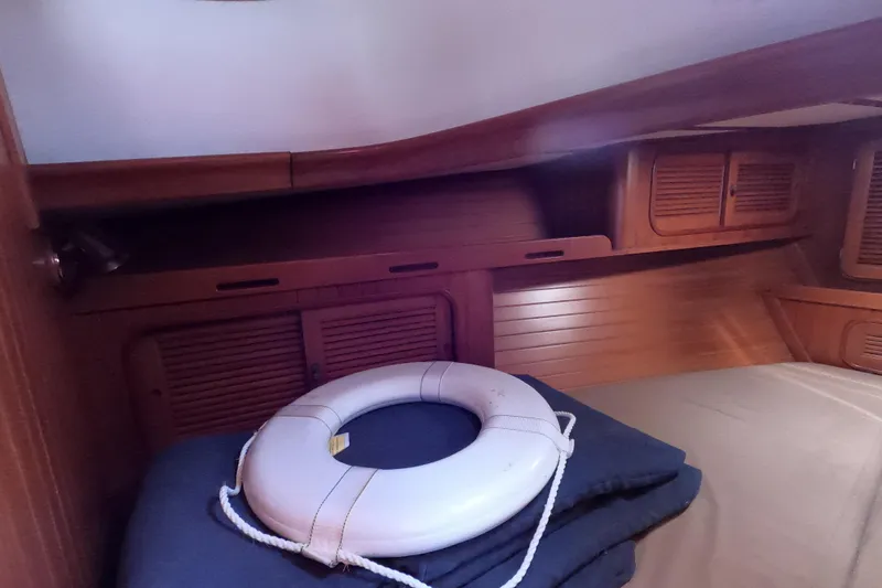 Slide: The Image of Interior of 1986 Ta Shing Baba 40 sailboat with wooden cabinetry and life preserver. - 24