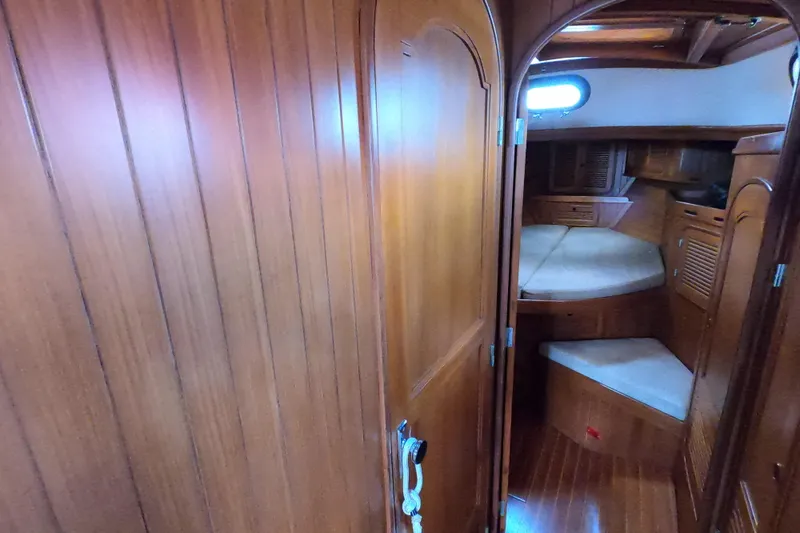 Slide: The Image of Interior of 1986 Ta Shing Baba 40 sailboat with wooden paneling and cozy cabin. - 29